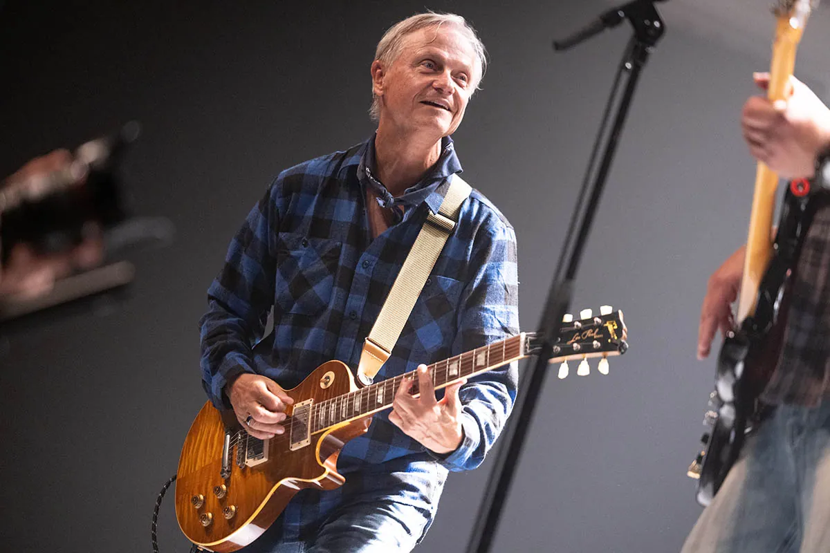 Guitarist on stage during a Creedence Experience concert